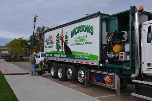 Barry Morton, president and CEO of Morton's Landscape Development, provided his own compost and blower truck for the field repair.
