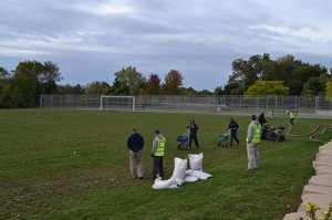 Volunteers from Weed Pro, Weed Man, Schill Grounds Management and Morton's Landscape Development arrived early to begin revitalizing the field.