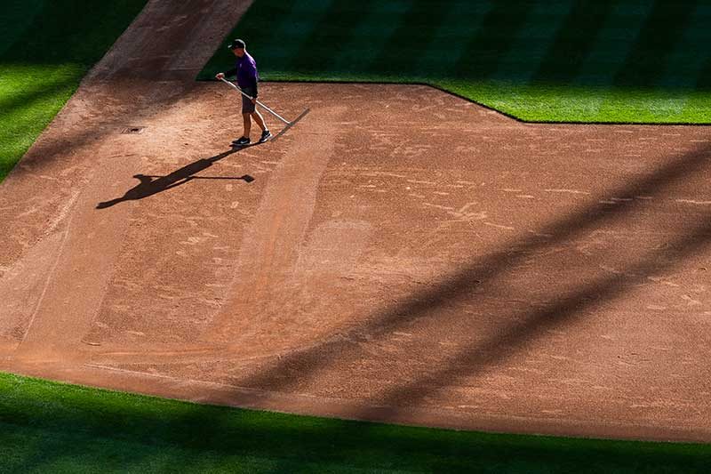 Mark Razum, head groundskeeper of the Colorado Rockies tends to the infield at Coors Field. (Photo: Colorado Rockies)