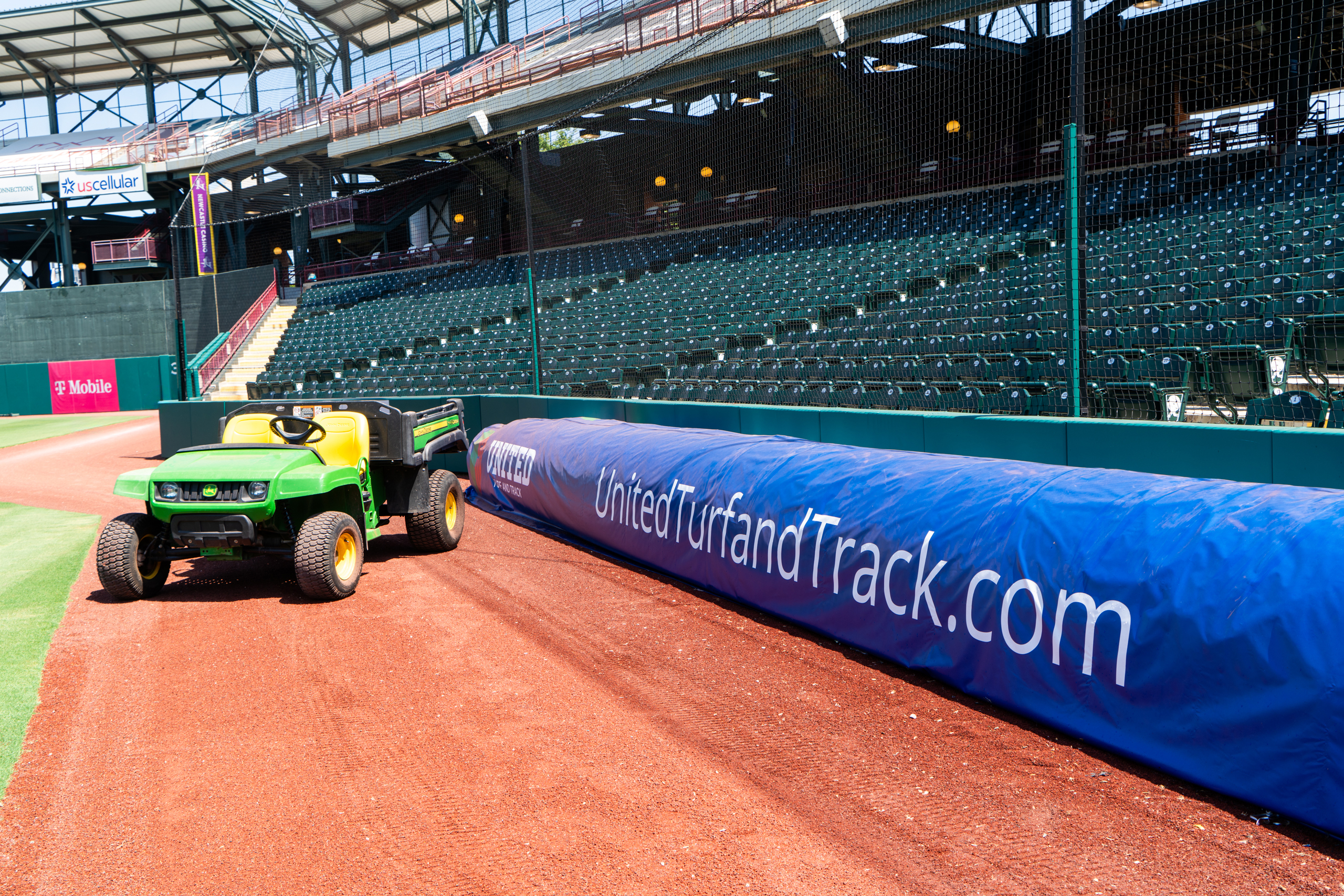 OKC Dodgers maintenance crew utility vehicle parked next to United Turf & Track tarp cover at Chickasaw Bricktown Ballpark. (Photo: United Turf and Track)