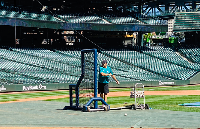 Director of Grounds Kevin Dvorak, a former college first baseman, occasionally moonlights as a batting practice thrower for the team. (Photo: Courtesy of the Seattle Mariners)
