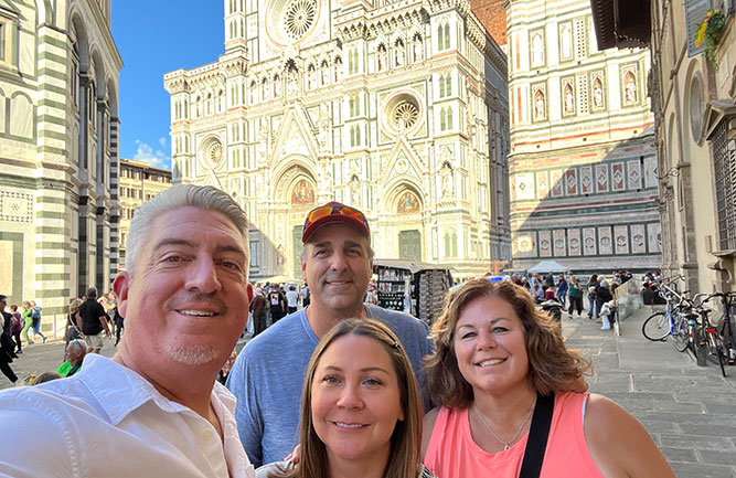Athletic Turf’s Seth Jones and his wife Adrianne, with Tom and Dana Groh, in front of the Duomo di Firenze in Florence, Italy. (Photo: AT staff)